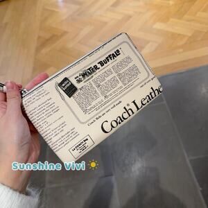 NWT Coach Large Corner Zip Wristlet with Newspaper Print Silver Chalk CDE80